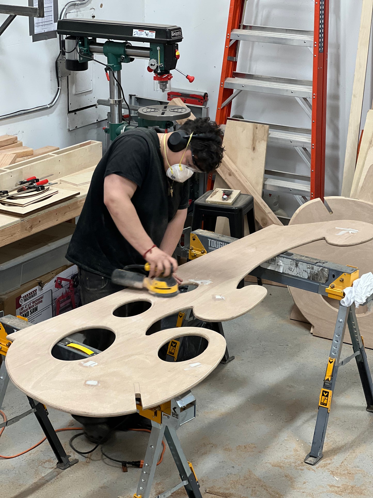 Sanding of Hurly Whirly by Beam Center youth